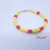 Yellow bracelet with cheep charm